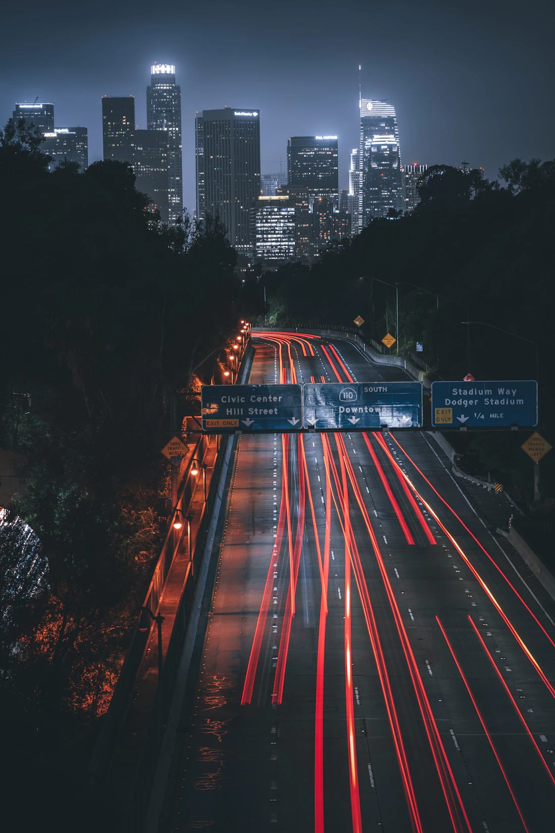 The 110 freeway leading into the Downtown Los Angeles skyline at night